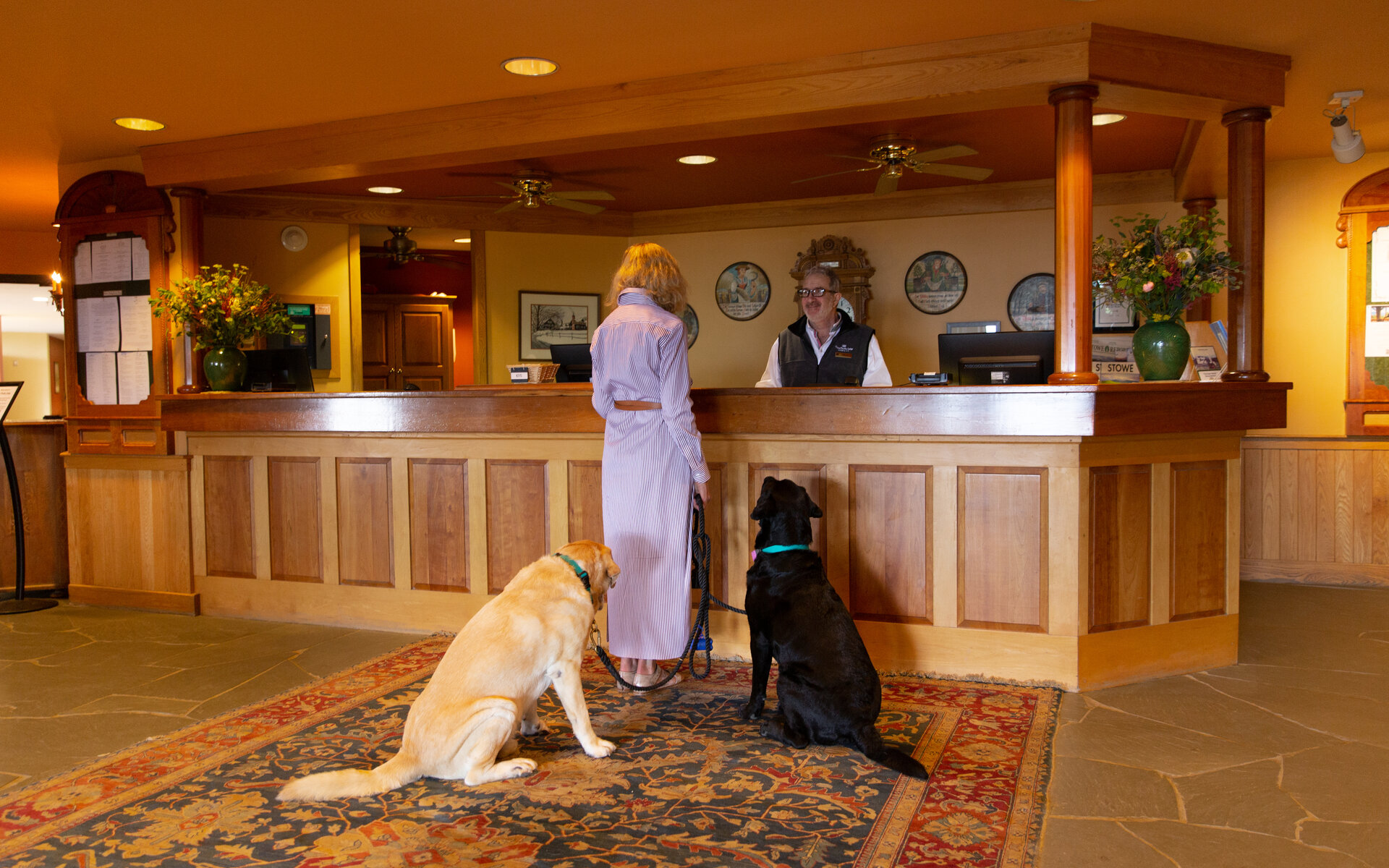 woman at front desk at our Stowe resort